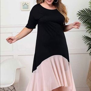 Women’s short sleeved black/pink pleated dress.